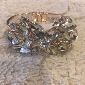 Rose gold tone bracelet with clear stones